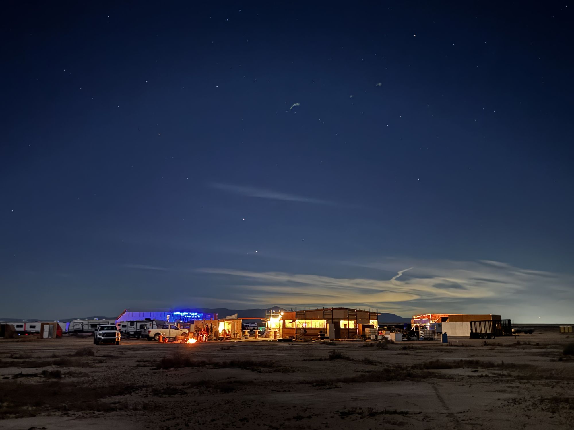 Freeside camp at night under a starry desert sky